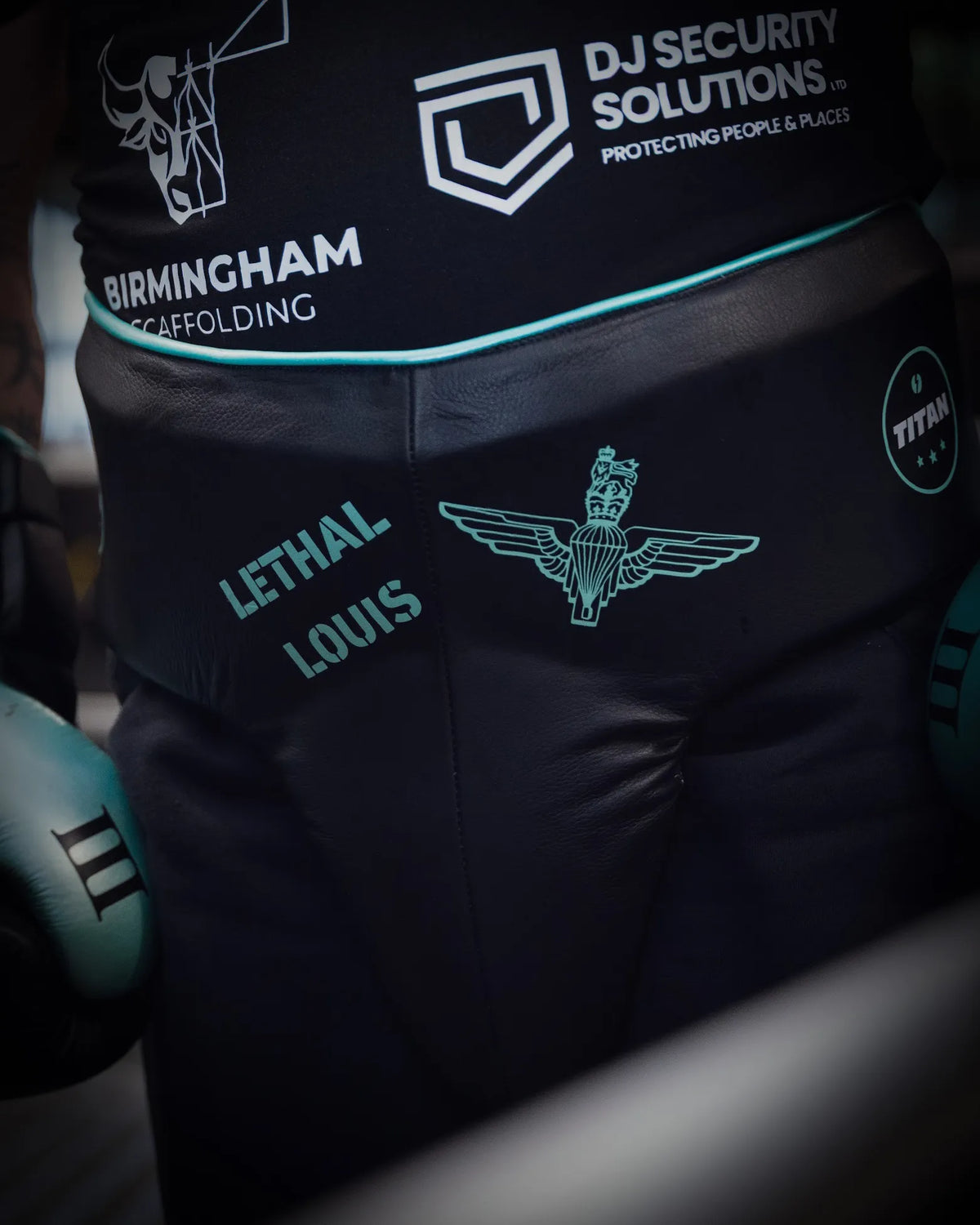 Titan Bespoke Ares groin guard in custom black leather with mint trim, personalised LETHAL LOUIS name and Parachute Regiment wings